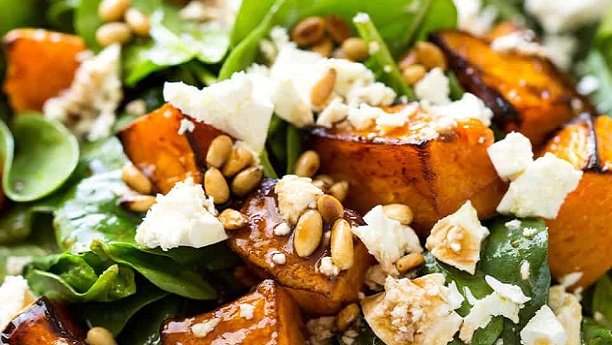Roasted capsicum and baby spinach salad with pine nuts and feta cheese